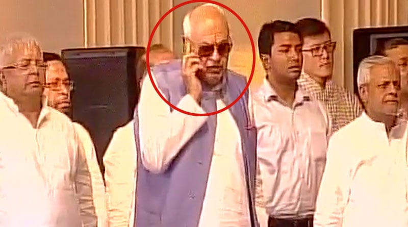 Farooq Abdullah talking on phone during the national anthem at Mamata Banerjee's oath taking ceremony