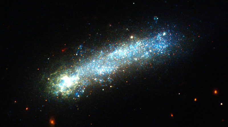 HUBBLE FINDS A FIREWORKS-FILLED TADPOLE ROCKETING THROUGH SPACE