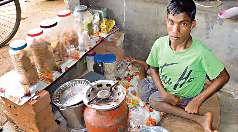 physically challenged biswajit helps his mother by running a tea stall in tri-cycle
