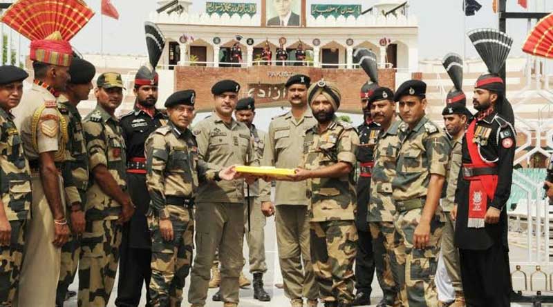 India, Pakistan border guards exchange sweets at border on the occasion of Eid