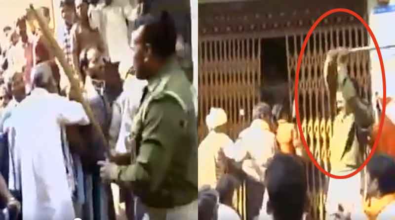 Policeman baton-charged people standing in queue outside bank in Fatehpur