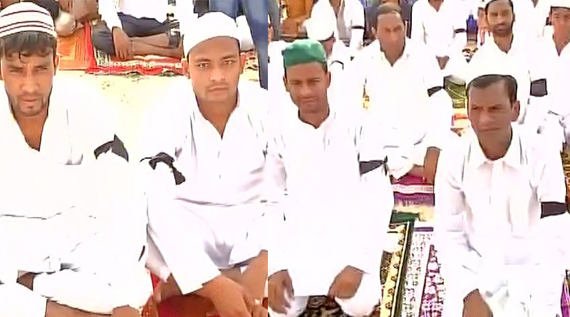 People wear black armbands during Eid prayer protesting Ballabhgarh lynching