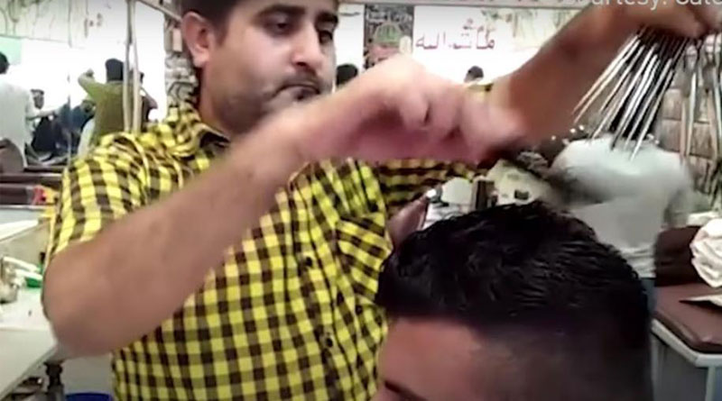 Pakistani barber uses 15 scissors at once to cut hair