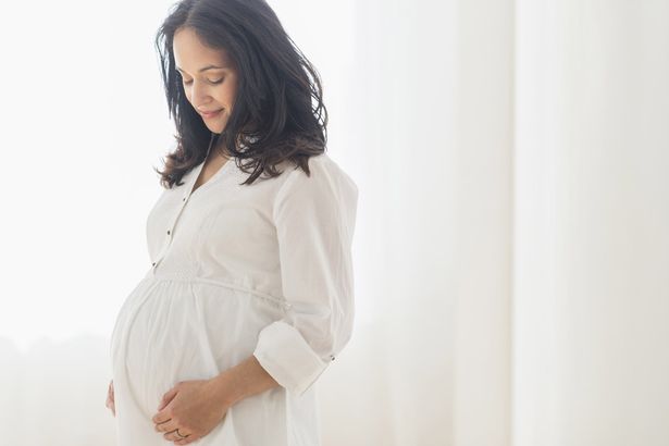 pregnant-woman-touching-her-belly-1489578466