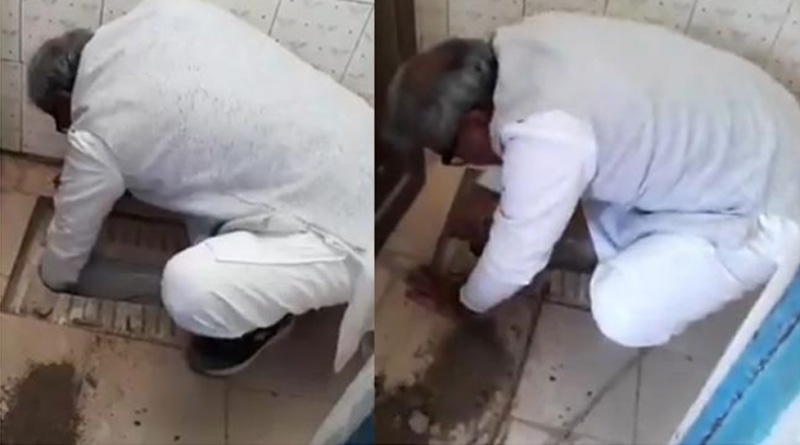 WATCH: BJP MP Janardan Mishra clean a school toilet in Rewa's Khajuha Village      after it had clogged and been out of use due to accumulation of soil. 