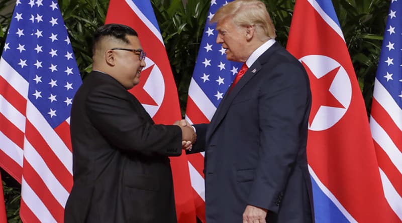 Trump and Kim shake hands before meeting