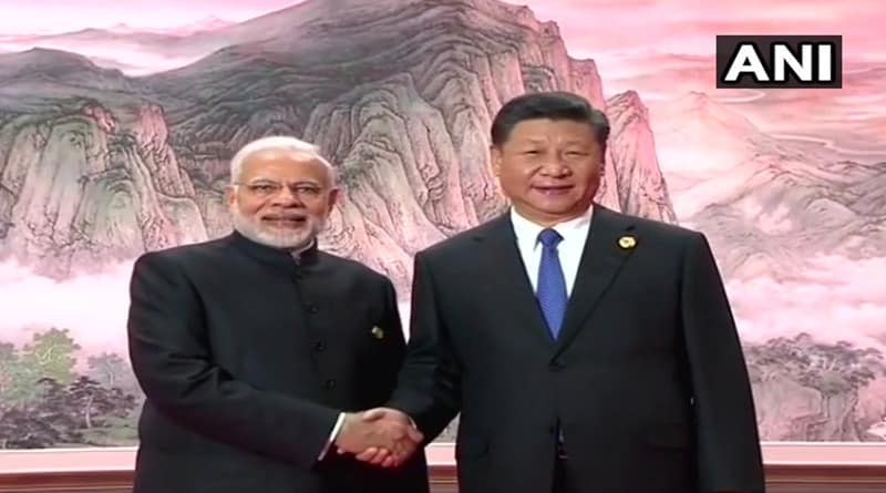 Prime Minister Narendra Modi meets Chinese President Xi Jinping at the welcome ceremony.