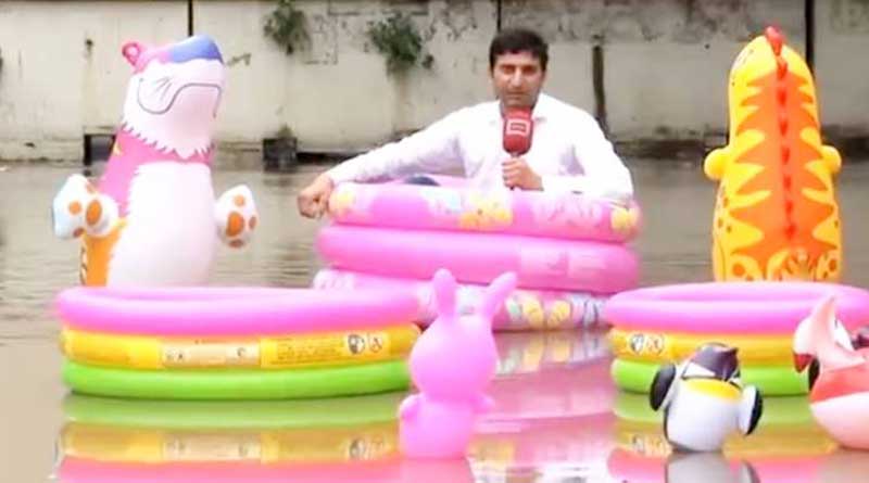 Pakistan journo sits on floating tubes reporting flood