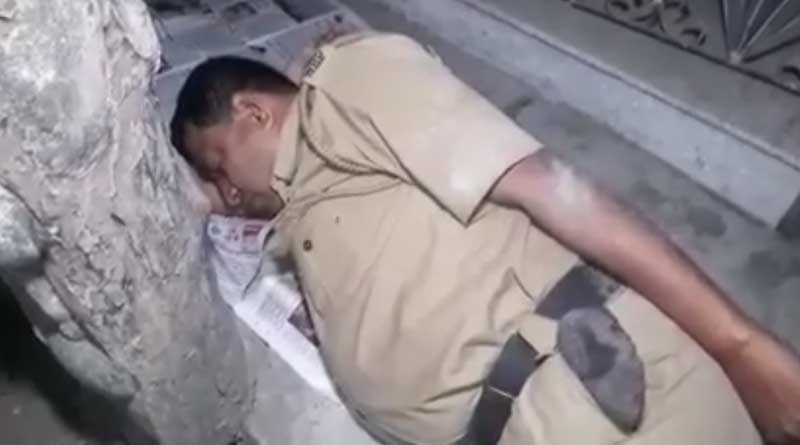 Cop lying on road at night