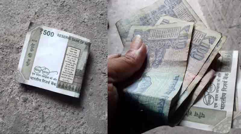 100 and 500 rupee notes is spread in Odlabari
