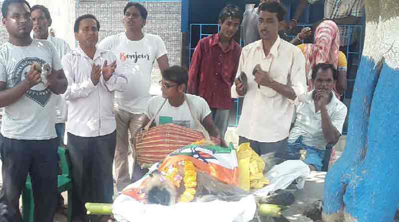 The deadbody of a monkey is covered with flag of TMC in Burdwan