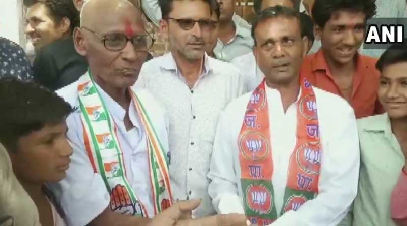 Congress worker shaves head after losing bet against BJP worker.
