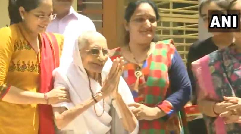 PM Modi’s mother Heeraben greets supporters as he gains huge lead.