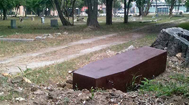 Mourners left stunned as coffin comes out of grave