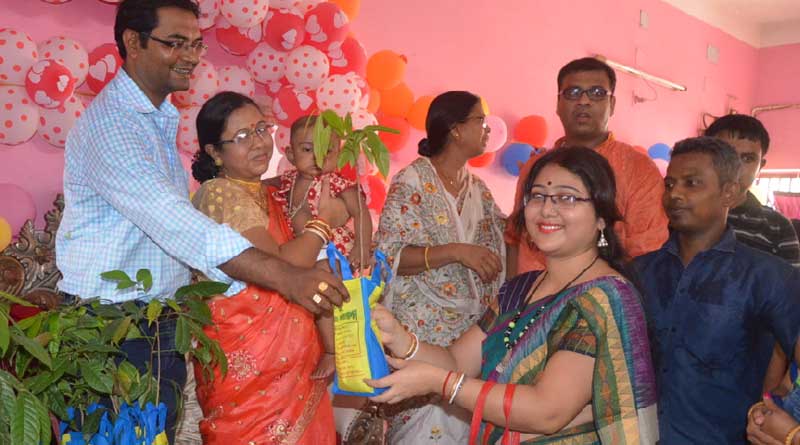 Couple distribute trees among the invitees in Katwa