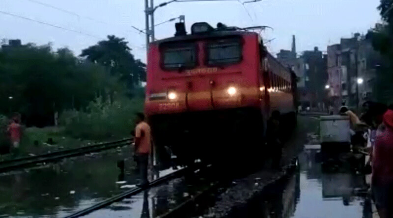 Heavy rain continue in Kolkata adjoining areas, train service hampered