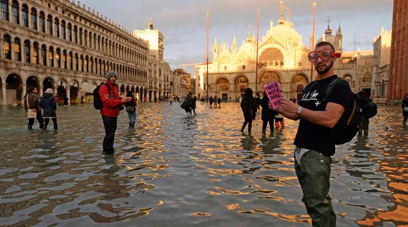 A tourist tries clicking selfie during Venice floods, falls into water