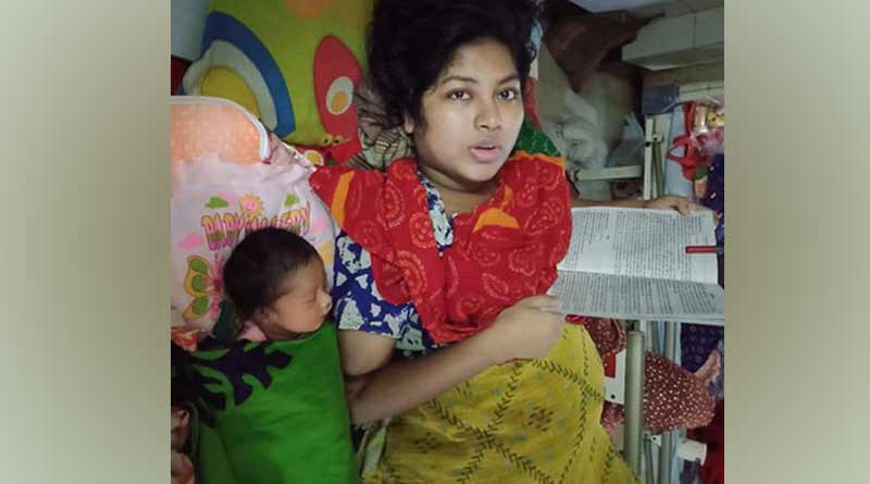 A Under garduate student in Bangladesh sits for exam with 5 days old child