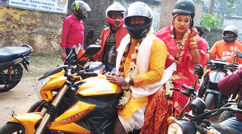 টোপরের বদলে হেলমেট, ‘সেফ  ড্রাইভ, সেভ লাইফ’-এর বার্তা দিতে অভিনব উদ্যোগ দম্পতির
