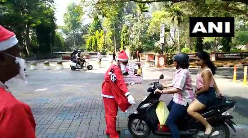 Goa Traffic Cops dressed as Santa Clause to gift chocolates to motorists.