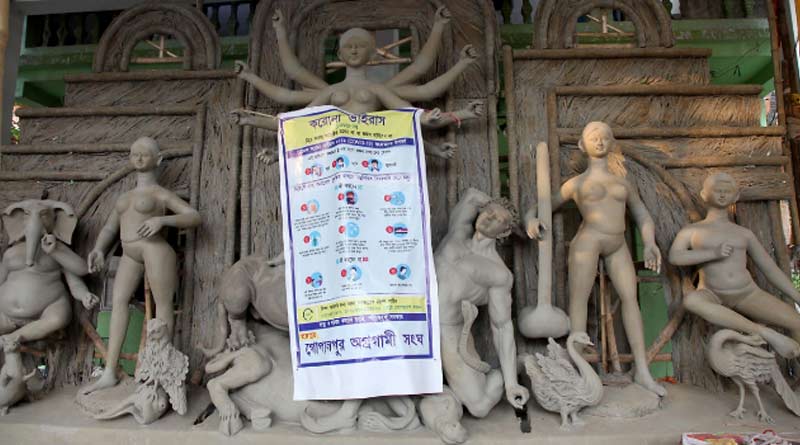 বাসন্তী পুজোর আয়োজনে কাটছাঁট, চাঁদার টাকায় দুস্থদের খাবার বিলি উদ্যোক্তাদের