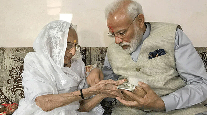 করোনা মোকাবিলায় ছেলের পাশে মা, প্রধানমন্ত্রীর ত্রাণ তহবিলে অর্থ দিলেন হীরাবেন