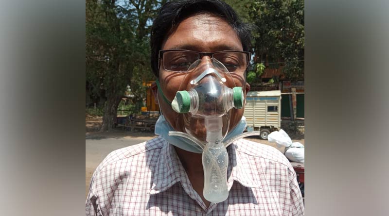 A man in East Burdwan makes environment friendly mask with abandoned things