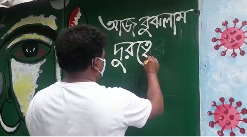 Kolkata Durga puja artist spreads corona awareness through graffiti