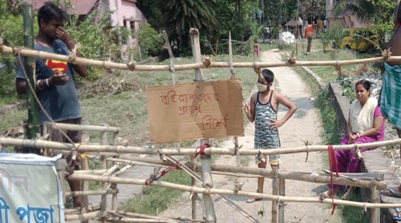 সংক্রমণের আশঙ্কা, বহিরাগতদের প্রবেশ আটকাতে রাস্তায় পাহারা গ্রামবাসীদের