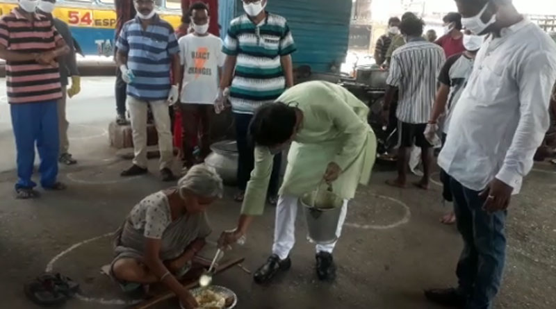 Minister Rajib Banerjee distributes food to needy people