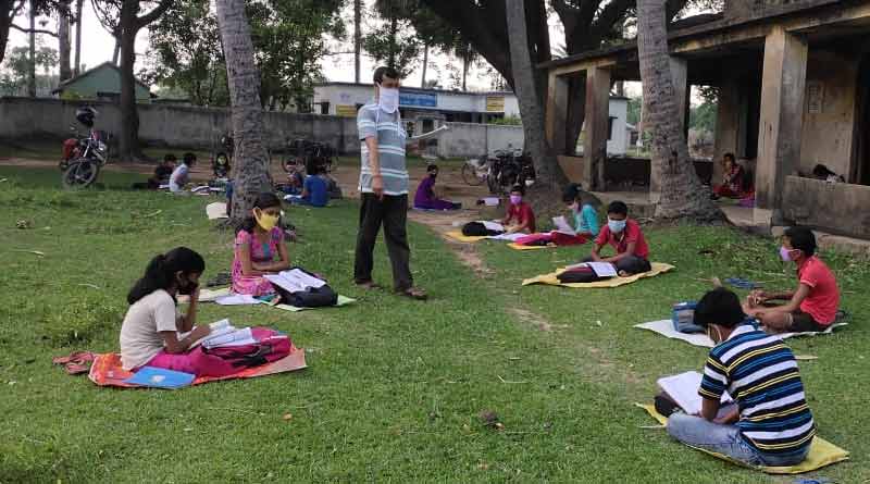 Private tutor starts classes in the field to maintain social distance at Aushgram
