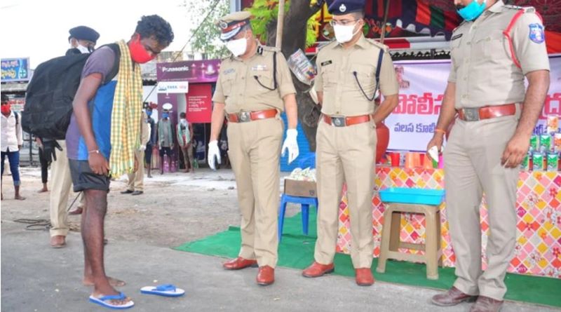 Andhra Pradesh cops provide footwear to migrants walking back home