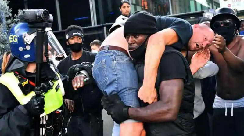 Pic of Black Man Carrying Injured White Man At London Protests viral
