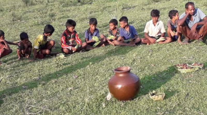 To ward off coronavirus, Odisha tribal village serves country liquor to children