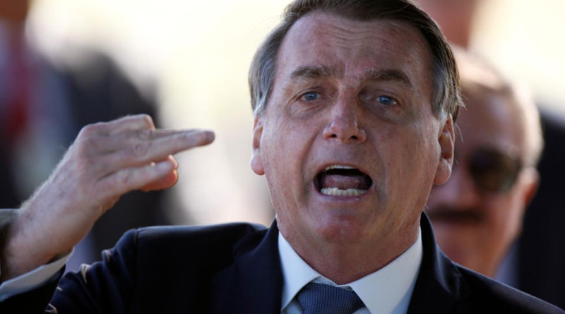 Brazil President Jair Bolsonaro threats journalist by punching him