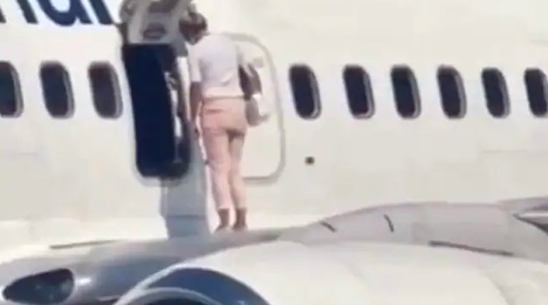Woman Walks Onto Airplane Wing, video goes viral