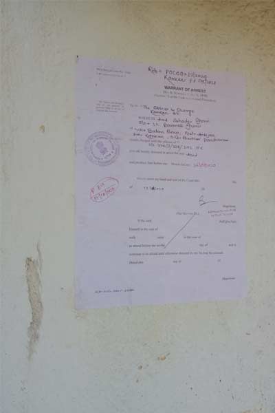 An arrest warrant in the name of the BJP leader's nephew hung on the wall of accused house