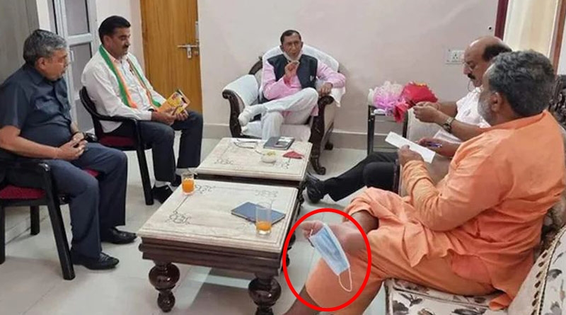 মুখে নয়, পায়ের পাতায় ঝুলন্ত মাস্ক! উত্তরাখণ্ডের মন্ত্রীর কাণ্ড ঘিরে বিতর্ক