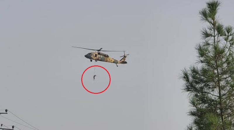 Video shows man hanging from Black Hawk helicopter flies over Kandahar | Sangbad Pratidin