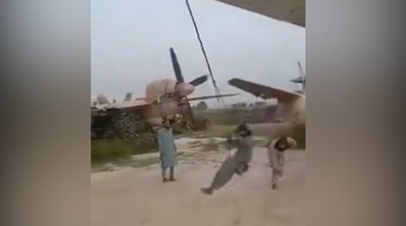 Video of Taliban militant swinging on plane wing goes viral | Sangbad Pratidin