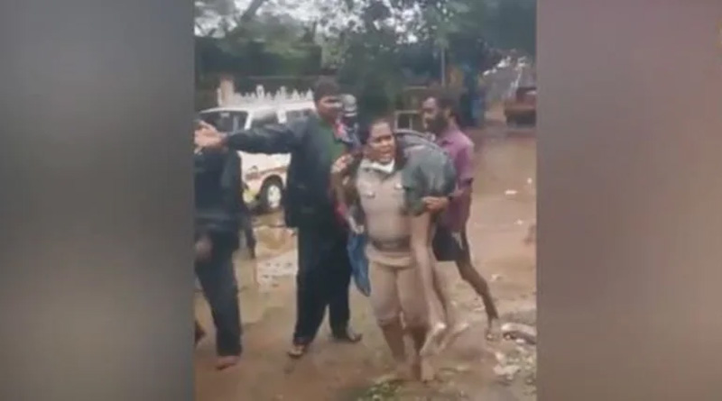 Viral Video: Woman police inspector carries unconscious man on her shoulders in rain effected Chennai | Sangbad Pratidin