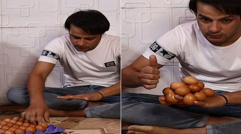 man has made a world record by placing lot of eggs on the opposite palm | Sangbad Pratidin