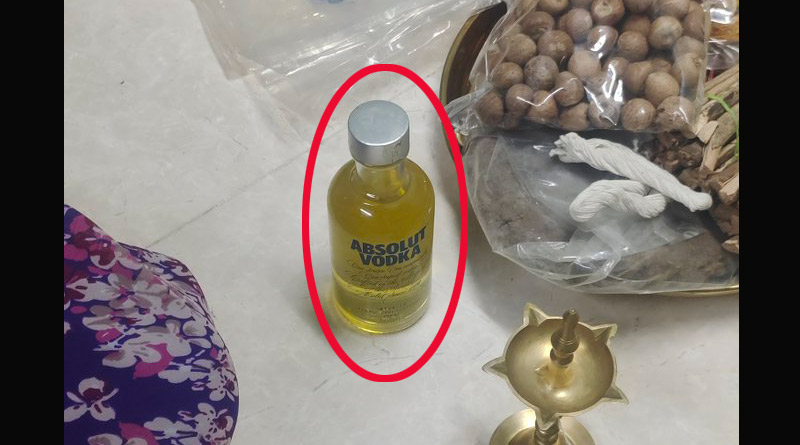 ভদকার খালি বোতলে ঠাকুরের প্রদীপ জ্বালানোর তেল! নেটিজেনের ছবি ঘিরে বিতর্ক