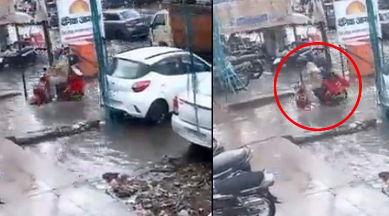 জল থইথই রাস্তায় স্কুটার নিয়ে সটান নর্দমায় পড়ে গেলেন সস্ত্রীক পুলিশকর্মী! তারপর…