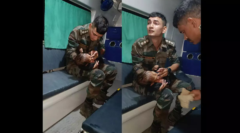 Indian Army soldiers rescued baby, trying to feed him, image goes viral | Sangbad Pratidin