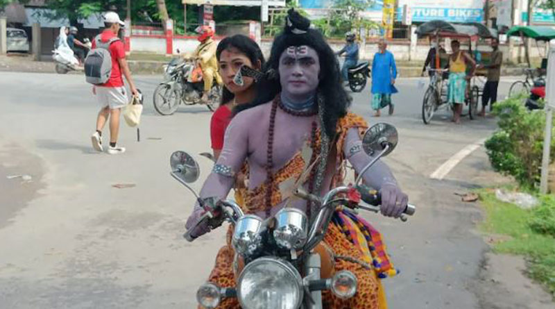 Assam man arrested for dressing up as Shiva, riding bike to stage drama against inflation। Sangbad Pratidin