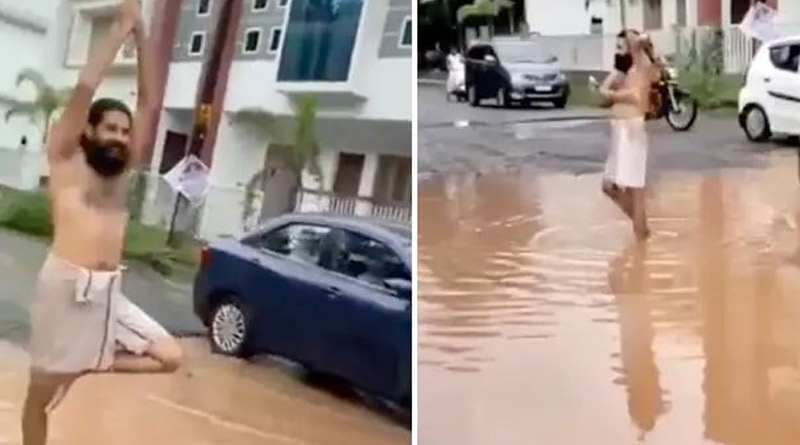 রাস্তার গর্তে ভরতি জল, সাবান-বালতি নিয়ে স্নান করে নজরকাড়া ‘প্রতিবাদ’ যুবকের