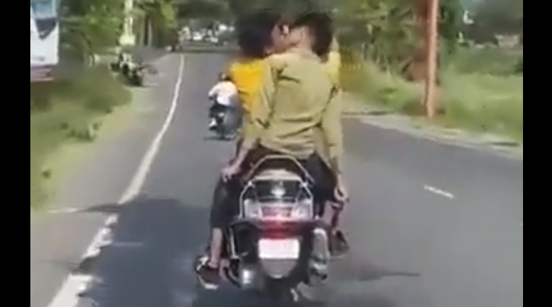 Guys Kissing in moving scooter, UP Police Take Cognizance of Viral Clip | Sangbad Pratidin