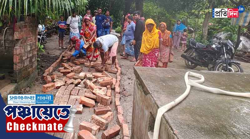 Panchayat Election: TMC leader bears expense of road repairing | Sangbad Pratidin