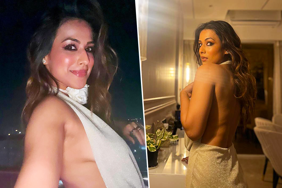 নেকলাইন থেকে উঁকি দিচ্ছে স্তনযুগল! মাখন খোলা পিঠে ছ্যাঁকা নিয়া শর্মার